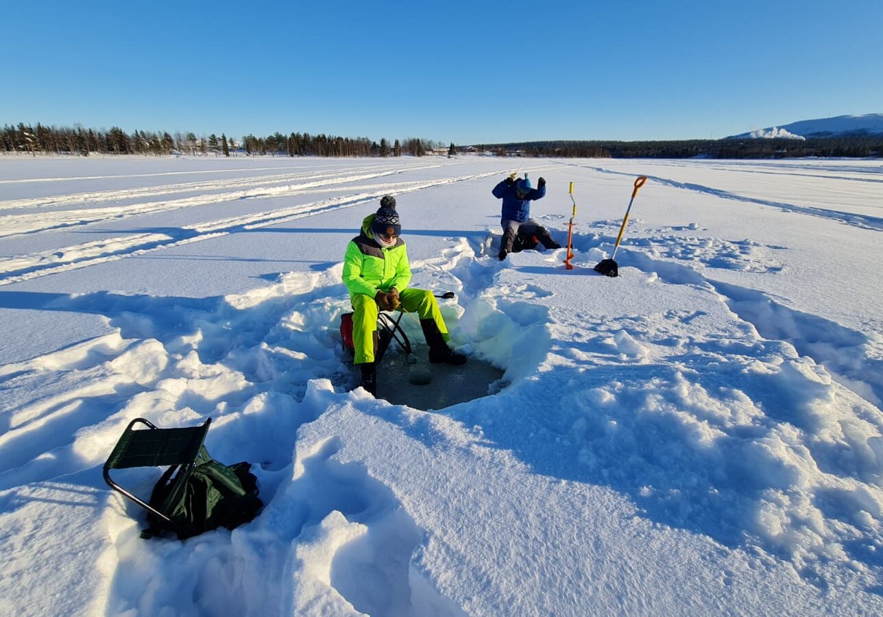 Easy snowmobile safari with ice fishing